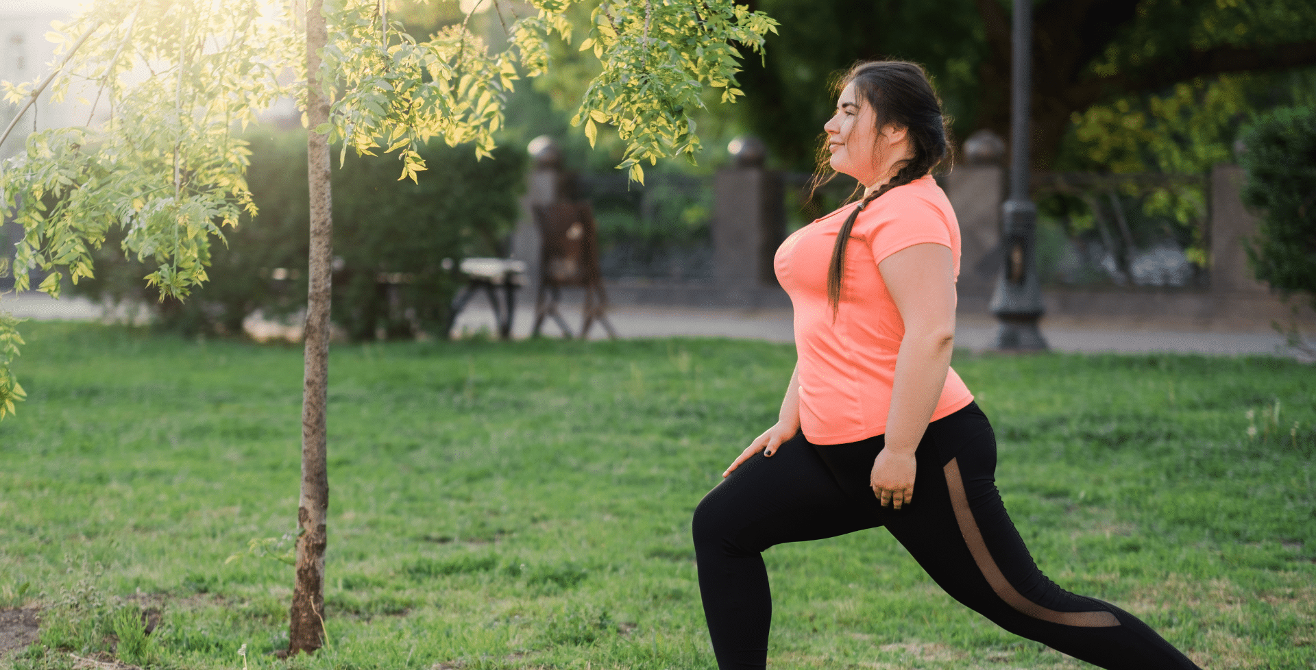 A woman exercising outside.