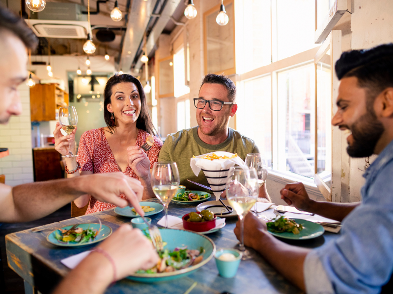 Friends eating at a restaurant.